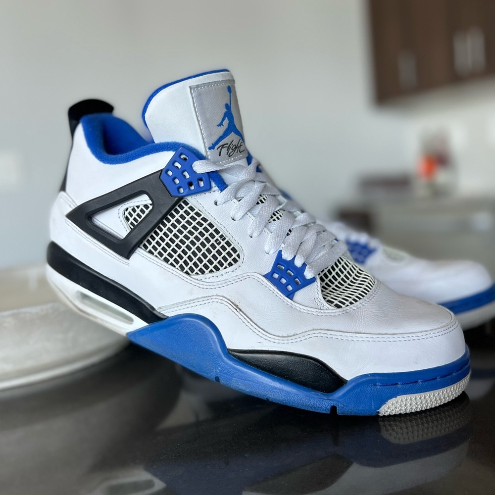 Air Jordan 4 Retro Motorsports. Blue, black, and white. Size 12.